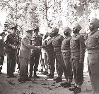 Prime Minister Winston Churchill meets with Sikh soldiers during WW-II Photo Courtesy IWM.London (67K)