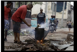 ManUsesBurningWood (64K)