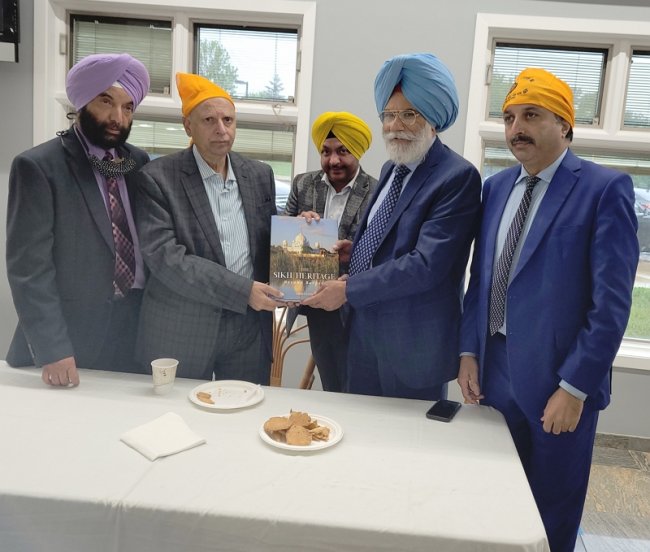 Pak Punjab Governor Sarwar visit SRS_28 May 2021_Darshan Singh Dhaliwal Dr Harjinder Khaira presenting Sikh Heritage Book.jpg